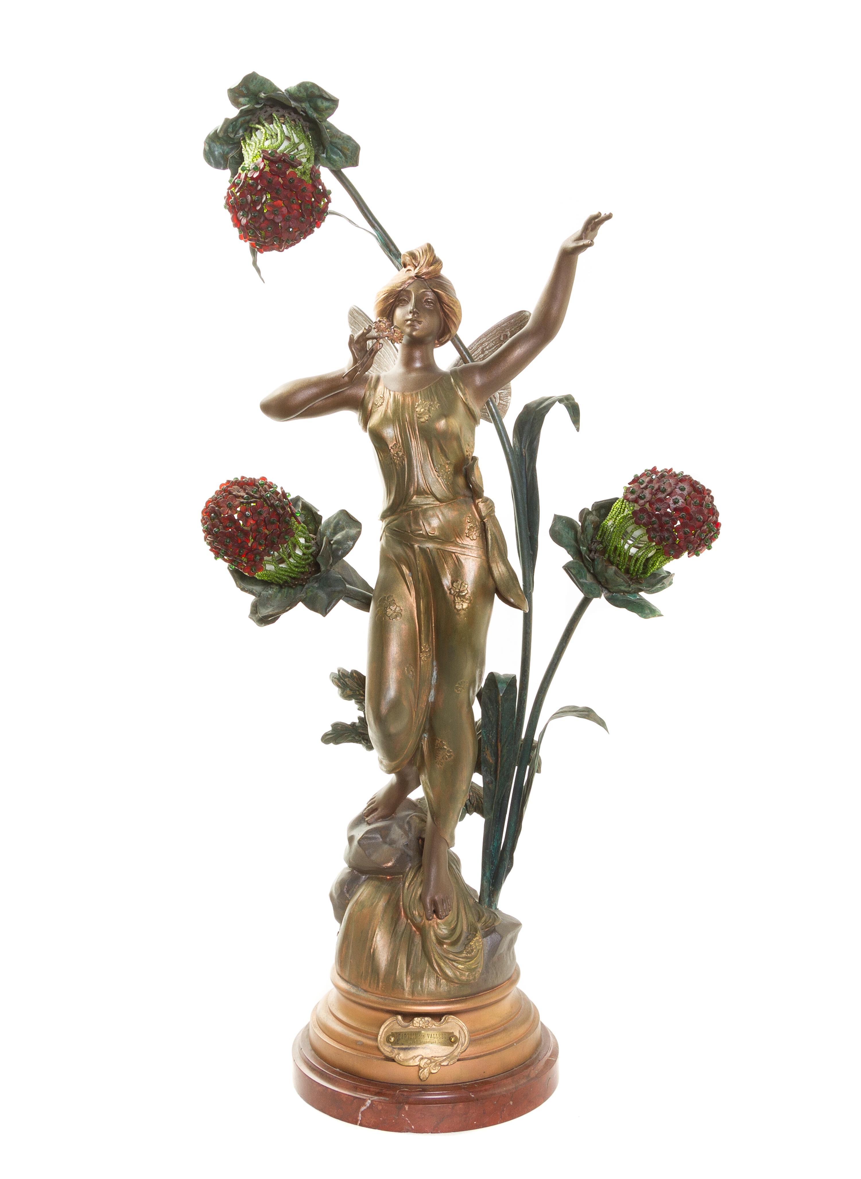 An Art Nouveau Cast Metal Three-Light Newel Post Lamp, AFTER C. BONNEFOND, Height overall 30 7/8 inches. — AFTER C. BONNEFOND,