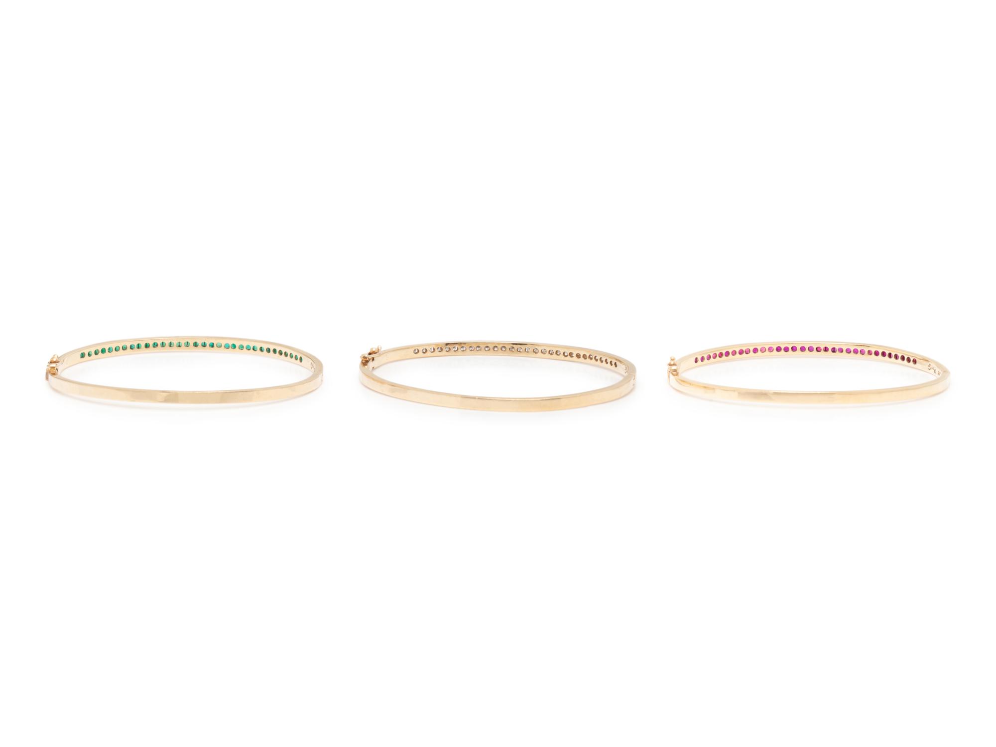 COLLECTION OF RUBY, DIAMOND, AND EMERALD BANGLE BRACELETS
