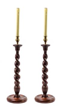 A Pair of Carved Oak Candlesticks