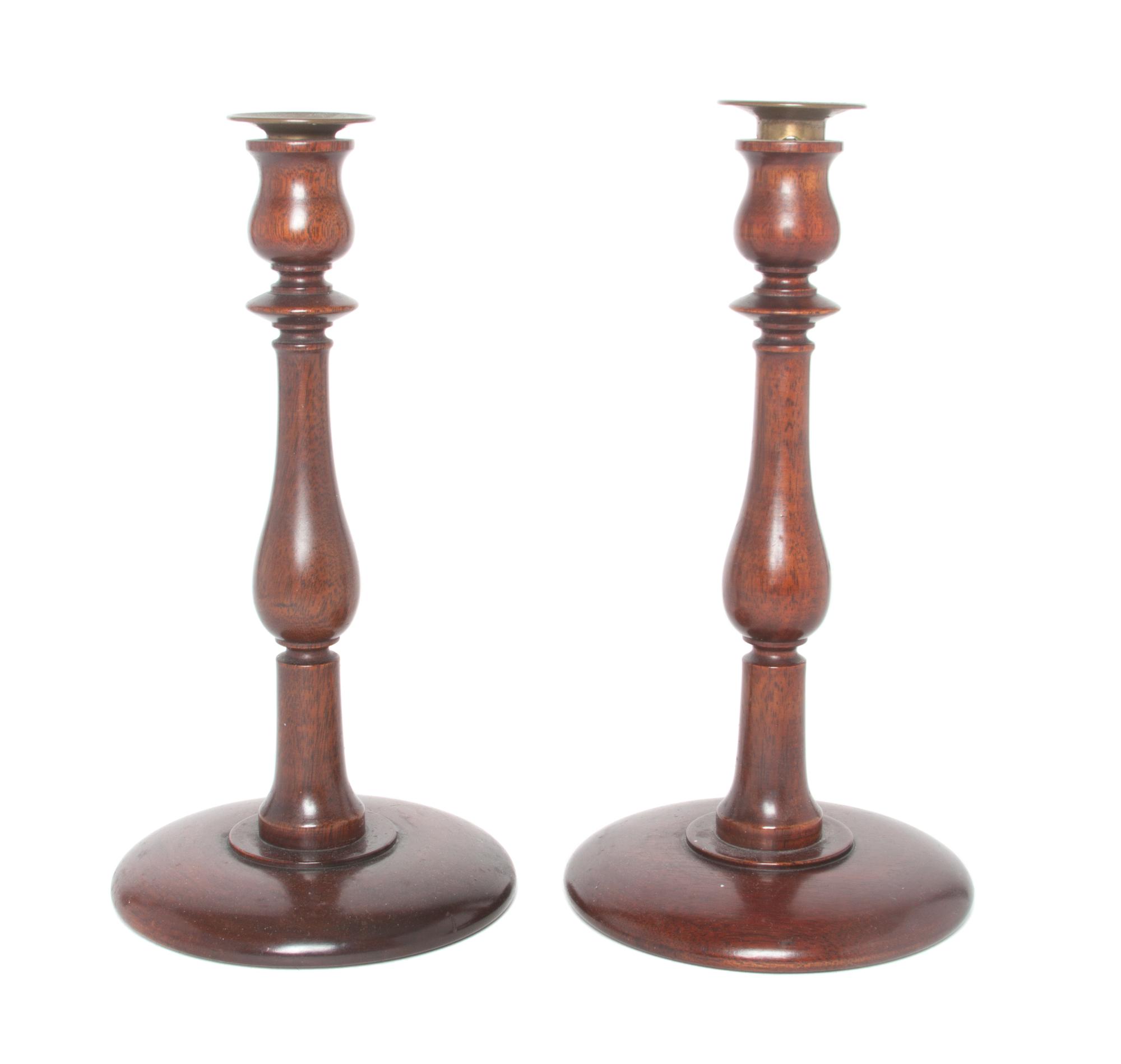 A Pair of Wooden Candlesticks Height 11 inches.