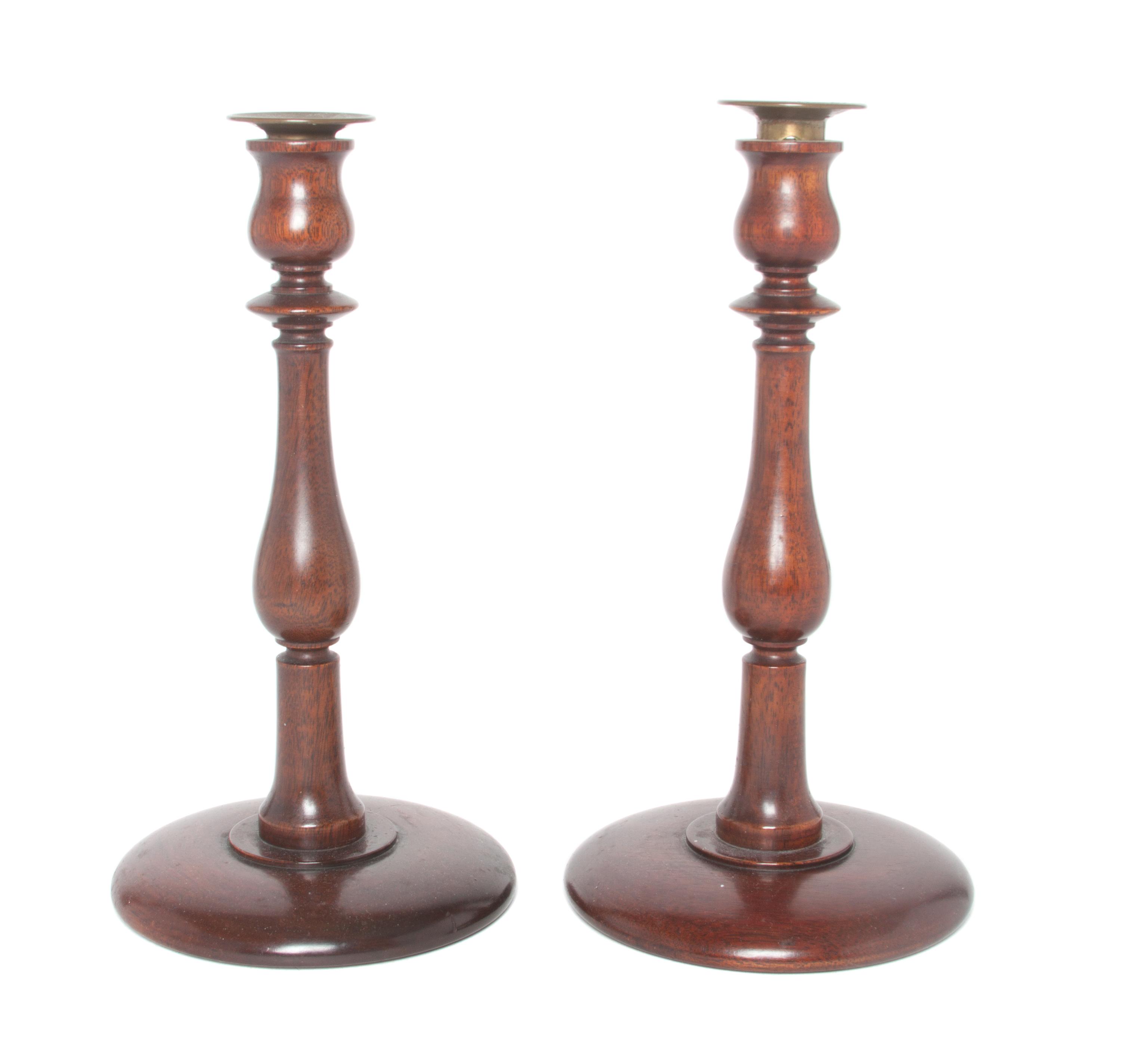 A Pair of Wooden Candlesticks Height 11 inches.