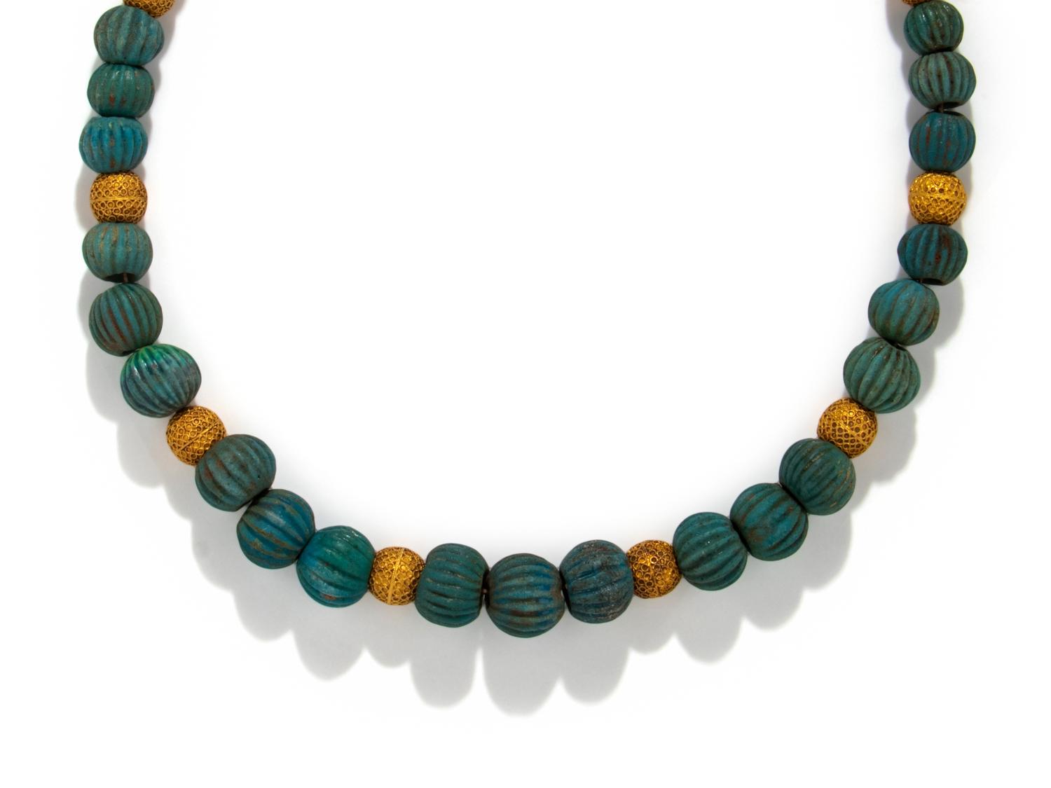 An Egyptian Faience and Gold Melon Bead Necklace