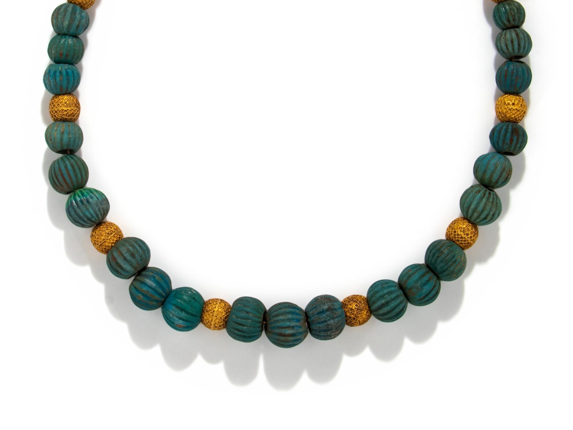 An Egyptian Faience and Gold Melon Bead Necklace