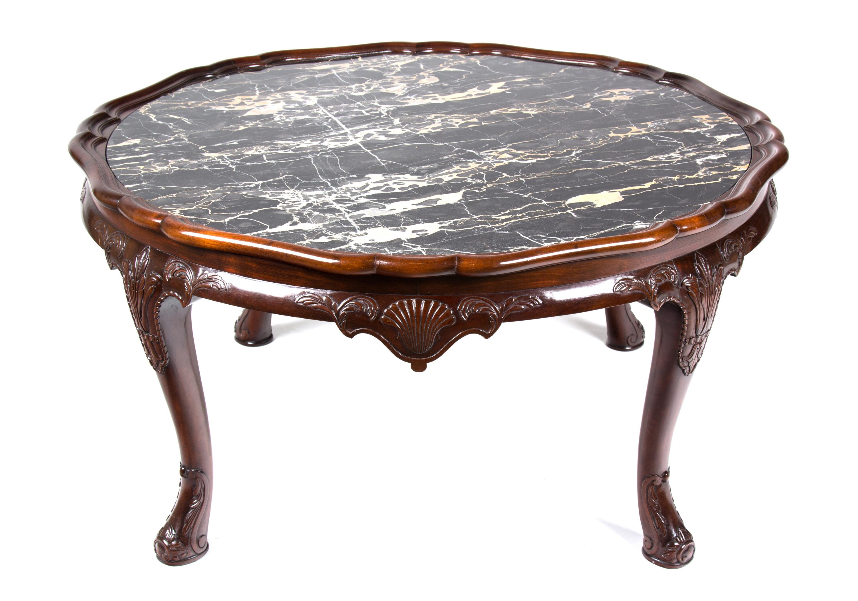 An English Mahogany Low Coffee Table Height 19 x diameter 38 inches. — 20TH CENTURY