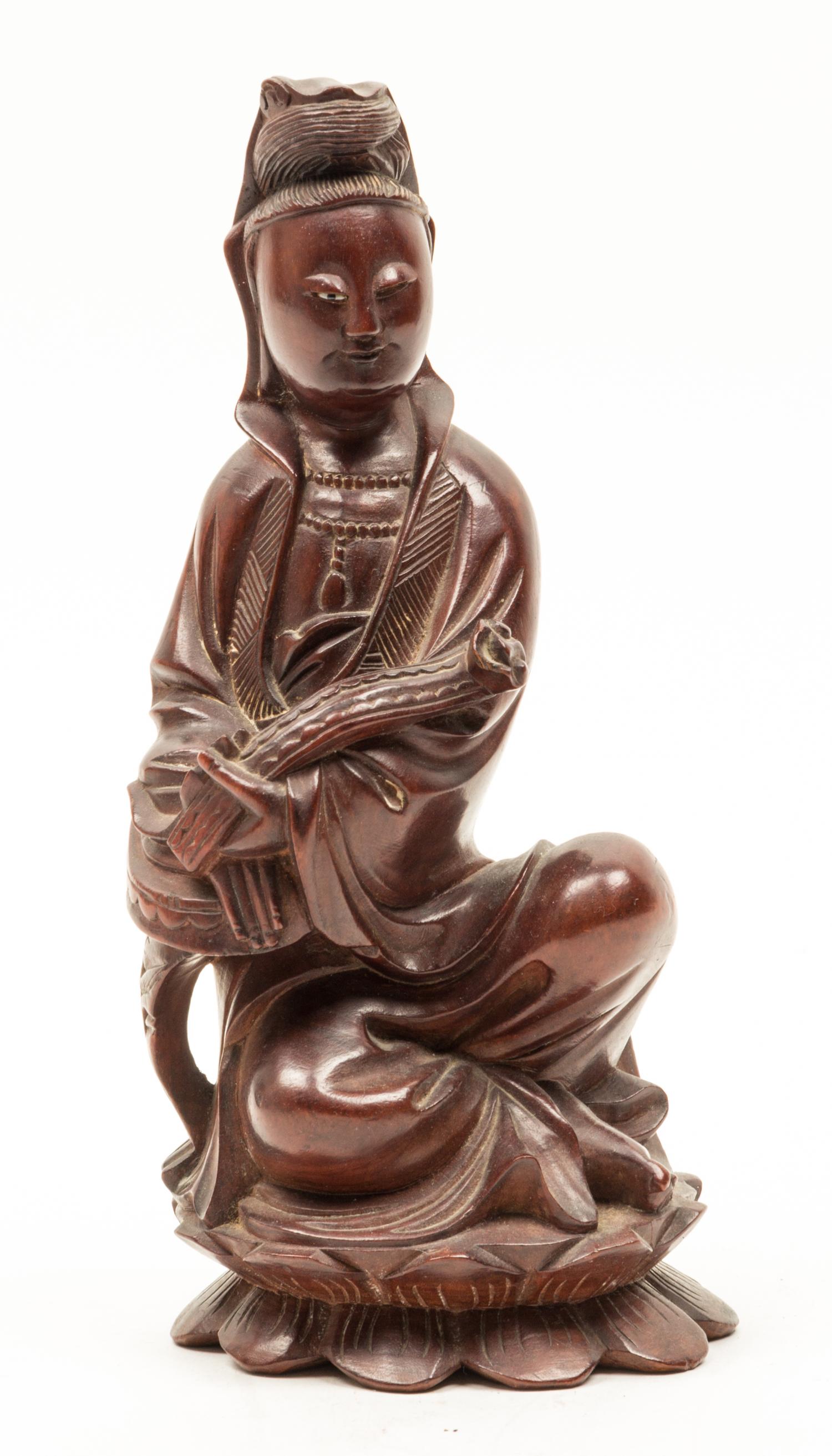 A Wood Figure of a Guanyin Height 9 1/2 inches.