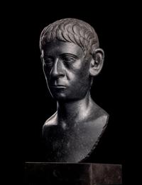 A Romano-Egyptian Black Basalt Male Portrait Bust