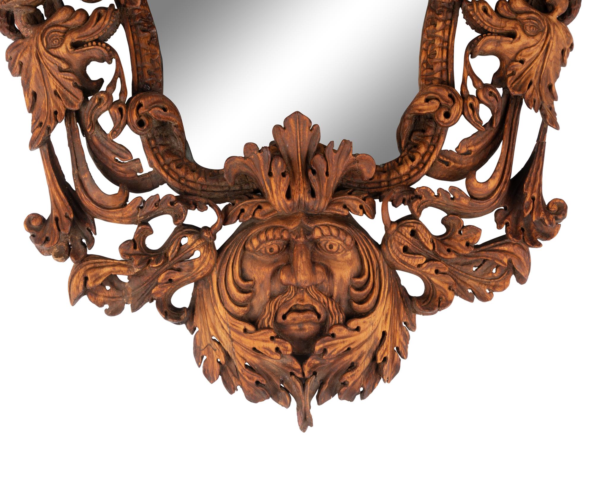 An Italian Carved Walnut Mirror in the Manner of Valentino Besarel