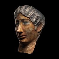 A Romano-Egyptian Painted Stucco Portrait Head of a Woman