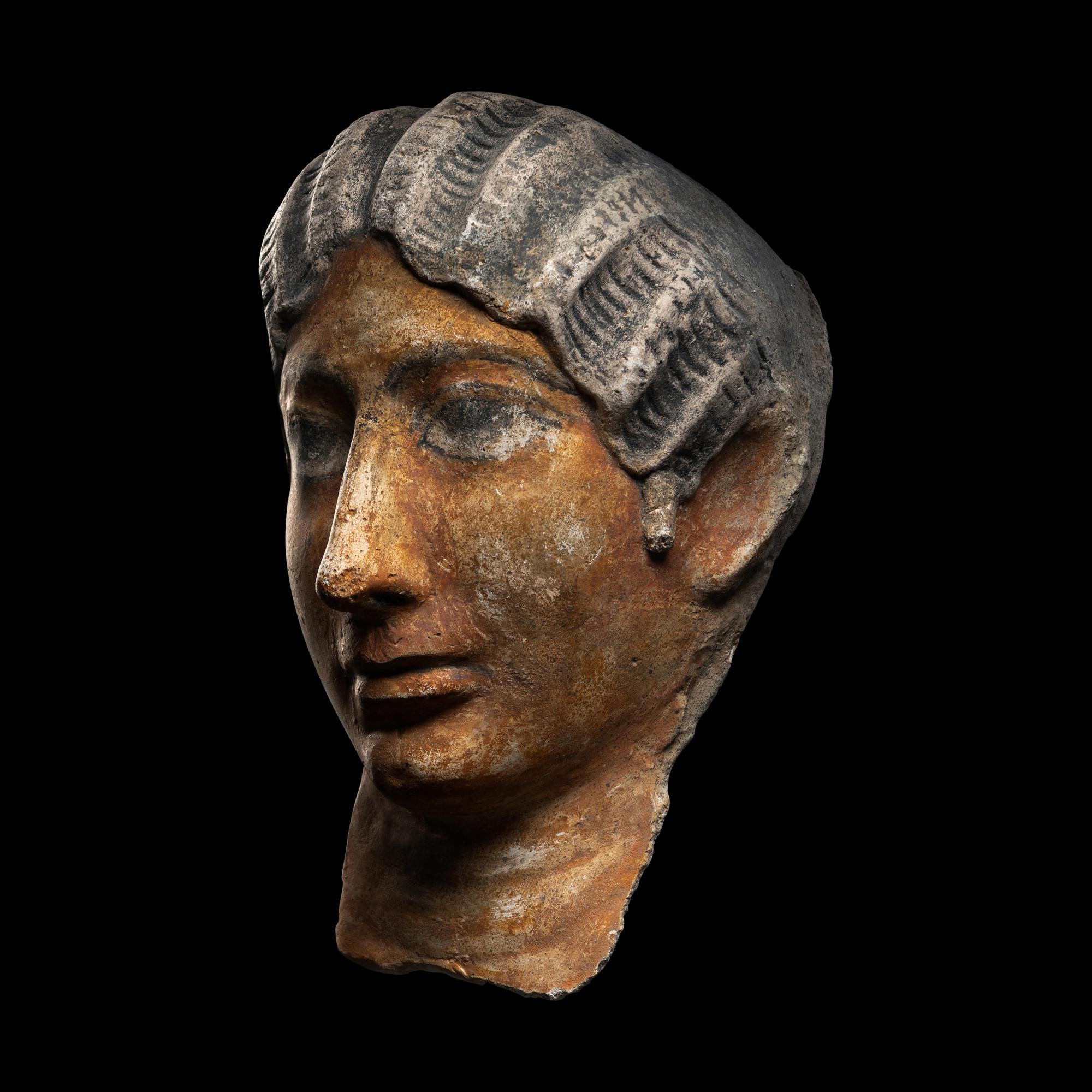 A Romano-Egyptian Painted Stucco Portrait Head of a Woman