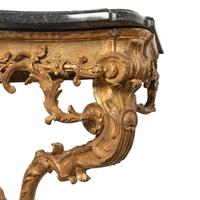 A Régence Carved Giltwood and Marble-Top Serpentine Console Table