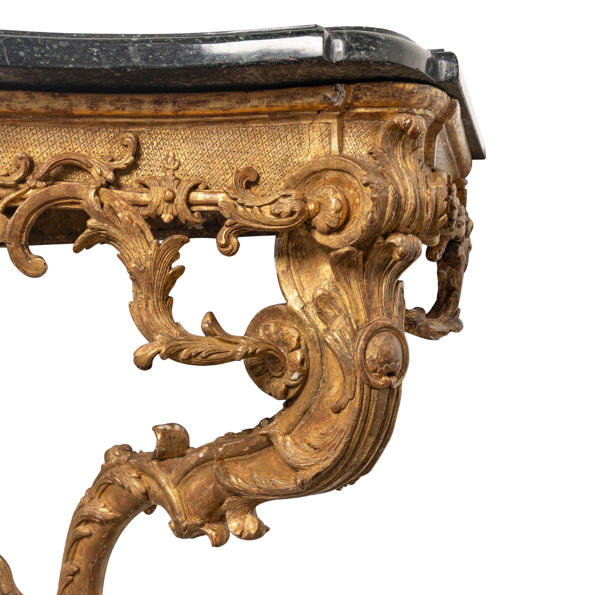 A Régence Carved Giltwood and Marble-Top Serpentine Console Table
