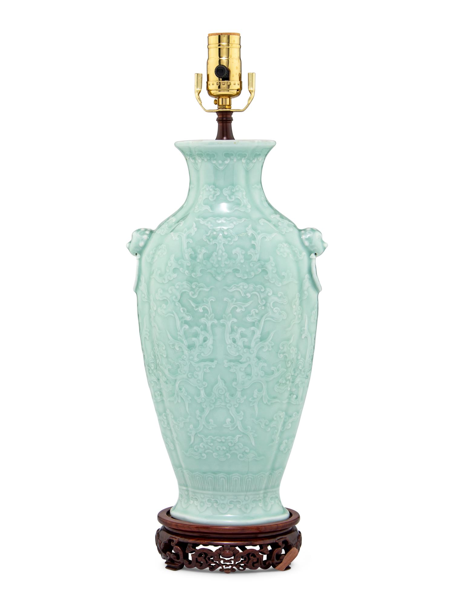 A Chinese Molded Celadon Ground Porcelain 'Phoenix' Vase