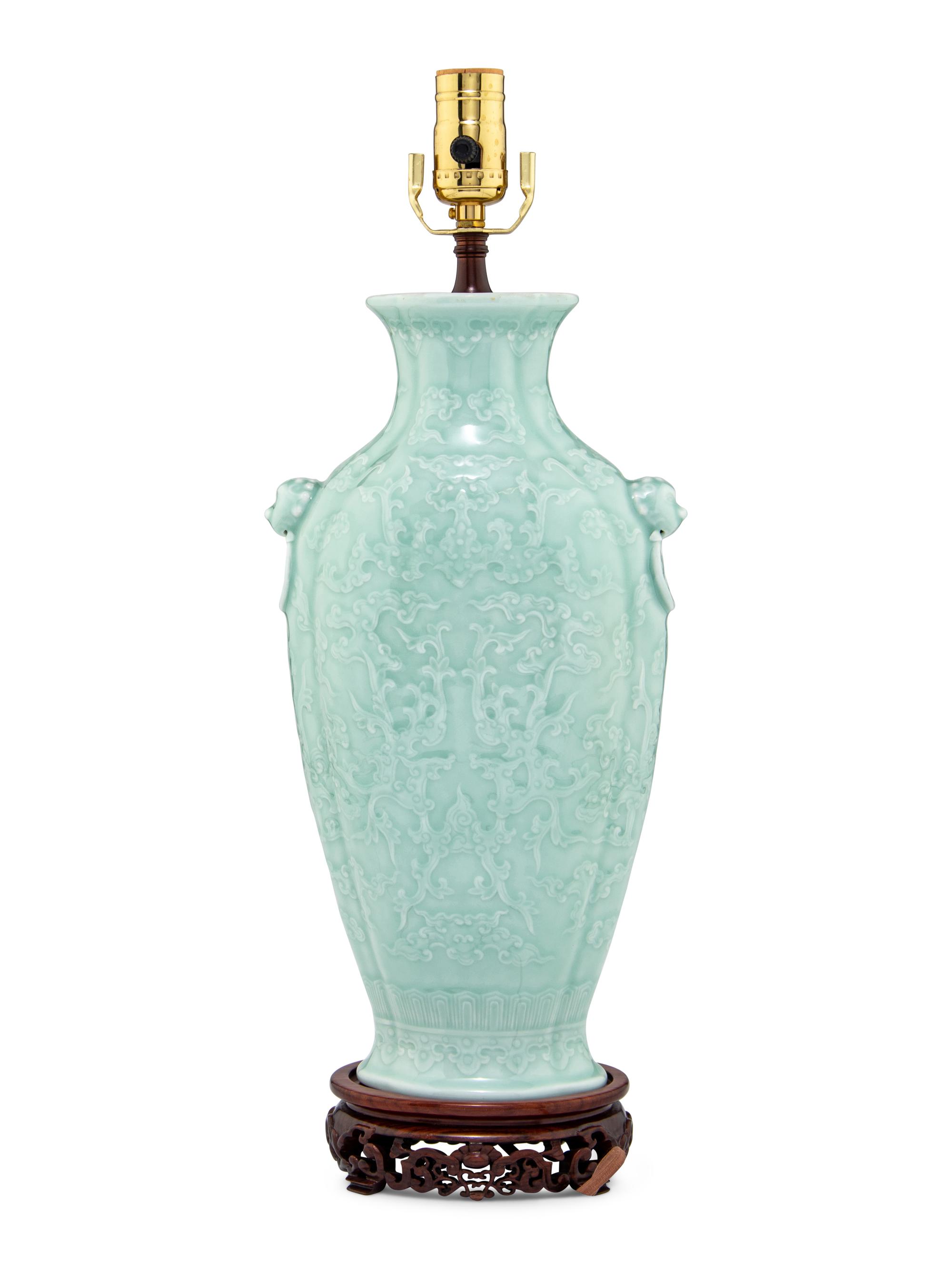 A Chinese Molded Celadon Ground Porcelain 'Phoenix' Vase