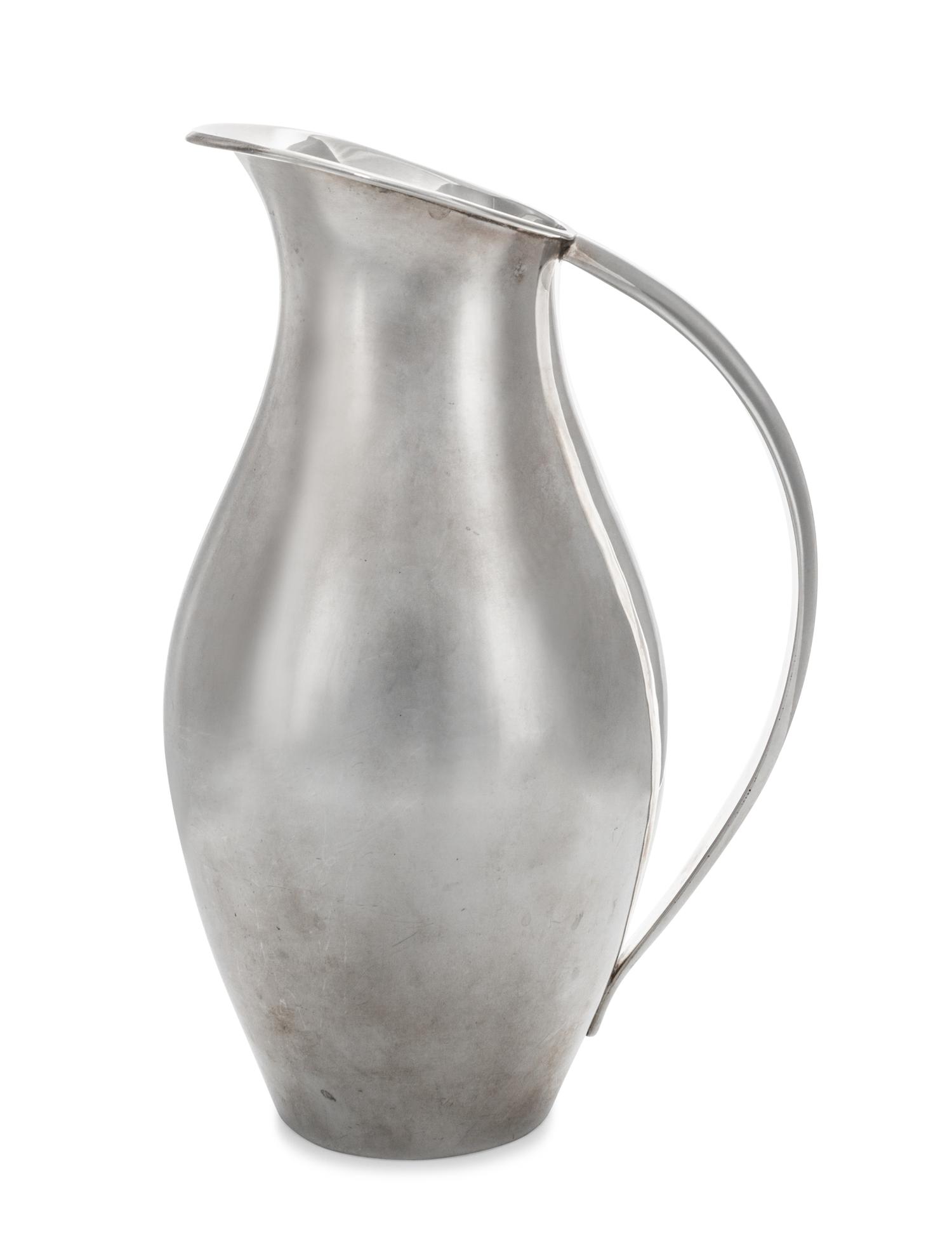 A Mexican Silver Water Pitcher, Juventino Lopez Reyes, Mexico City, 20th Century, of modernist form with applied handle.