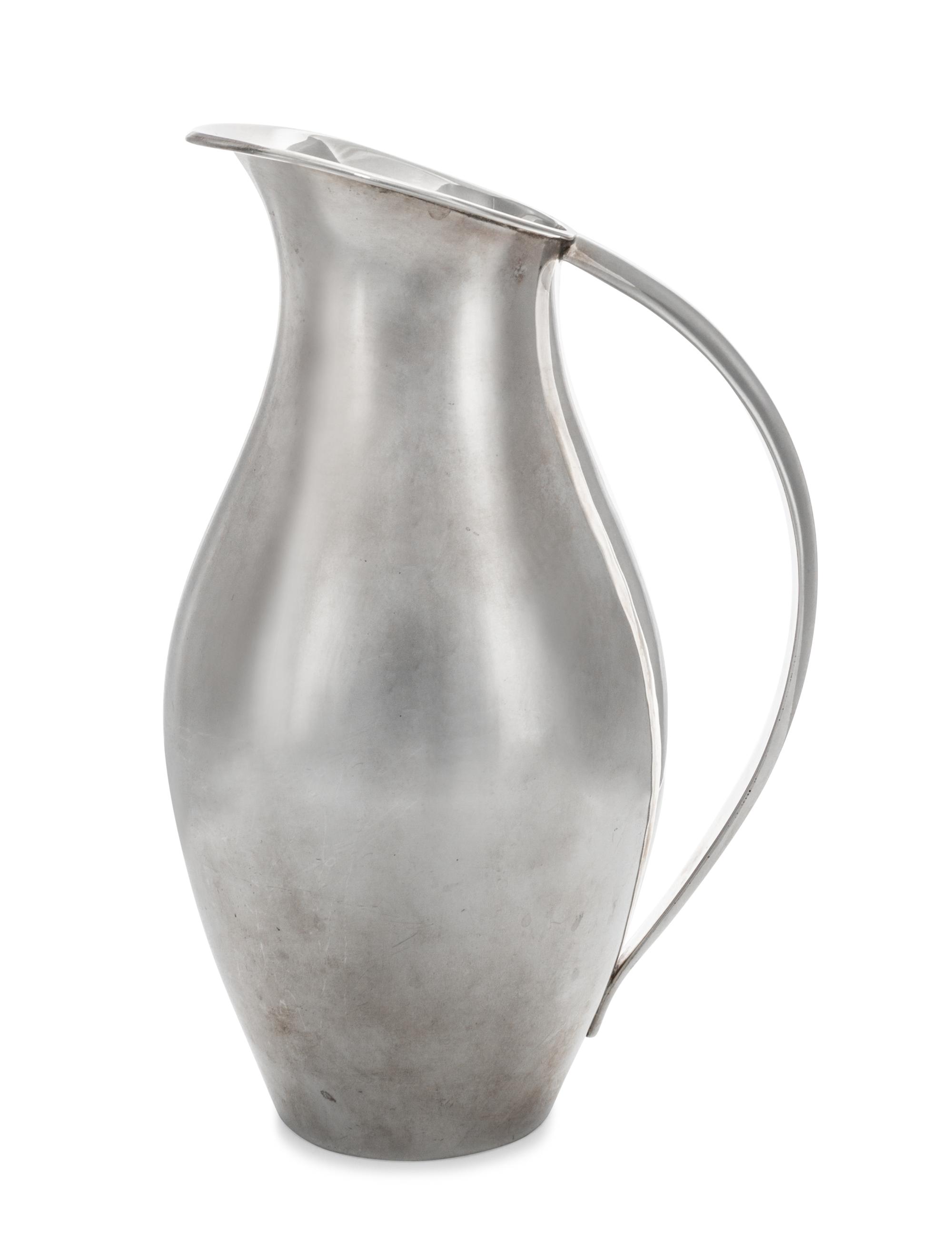 A Mexican Silver Water Pitcher, Juventino Lopez Reyes, Mexico City, 20th Century, of modernist form with applied handle.