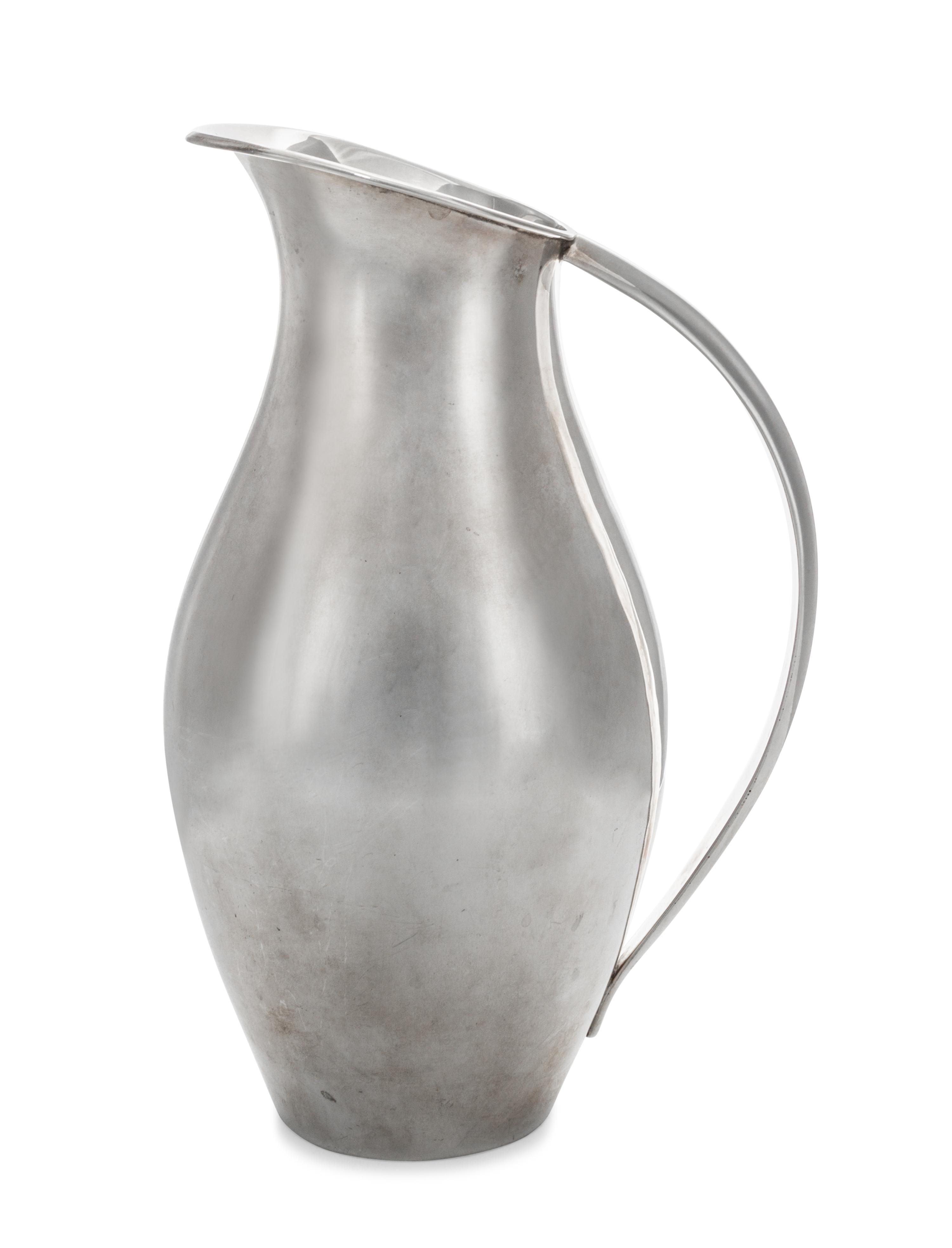 A Mexican Silver Water Pitcher, Juventino Lopez Reyes, Mexico City, 20th Century, of modernist form with applied handle.