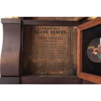 A Seth Thomas Empire Mahogany and Giltwood Shelf Clock