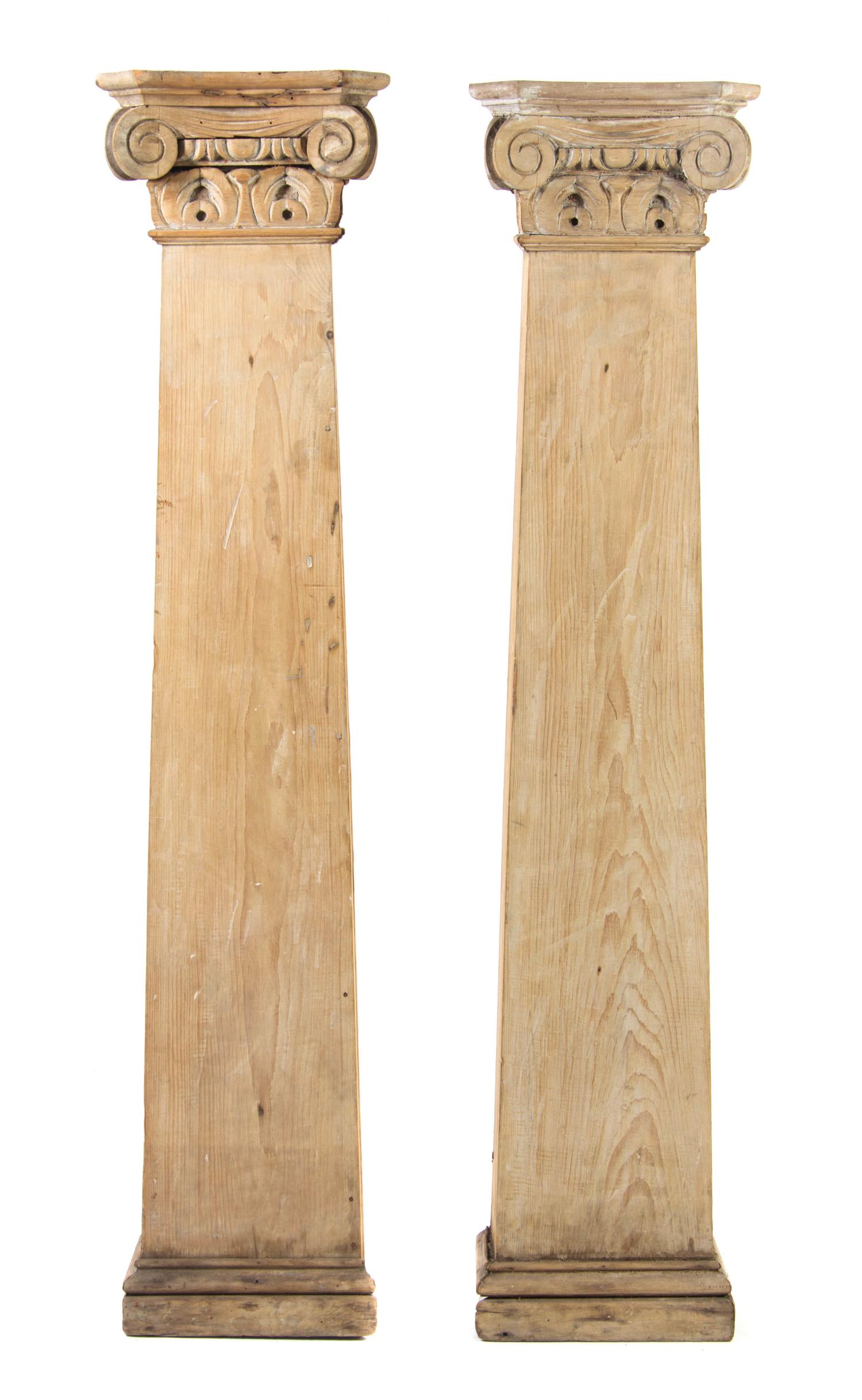 A Pair of Carved Pine Columns, Height 66 3/4 inches.