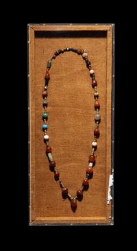 A Near Eastern Stone and Faience Bead Necklace