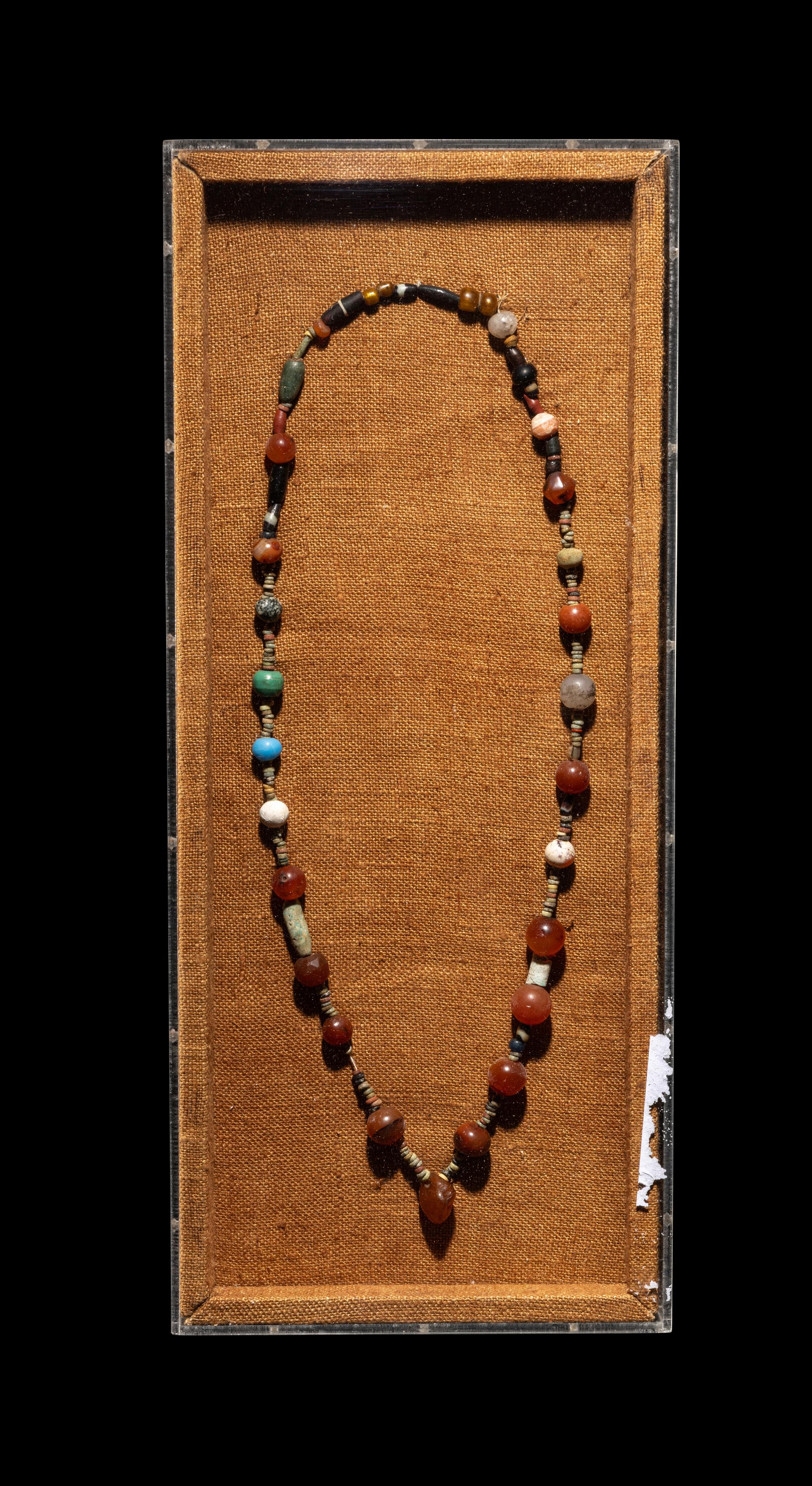 A Near Eastern Stone and Faience Bead Necklace