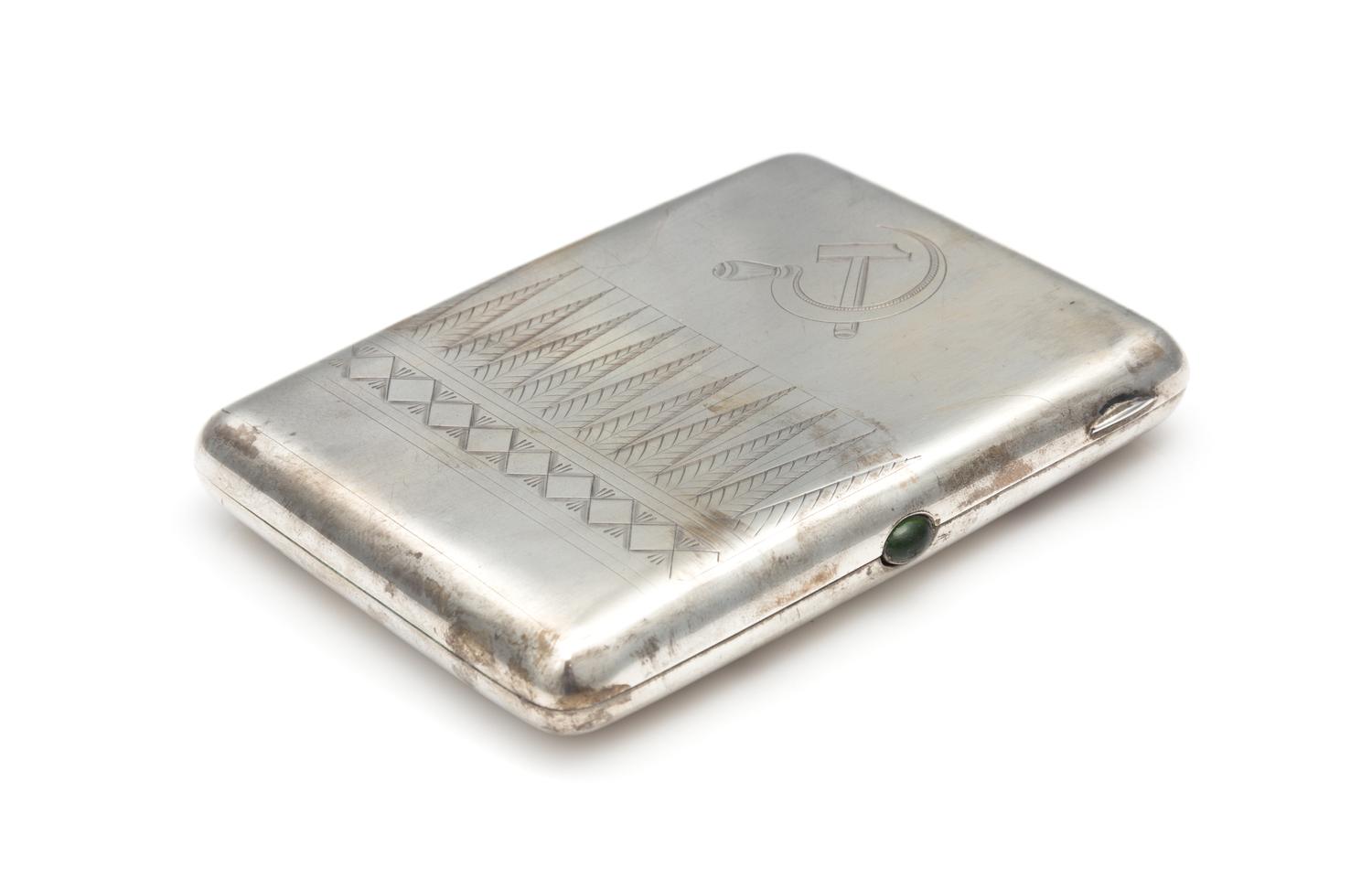 A Soviet-Era Russian Silver Cigarette Case, Maker's Mark Cyrillic YuKaA, Moscow, Early to Mid-20th Century, the case engraved to show a