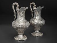 A Pair of American Repousse Silver Presentation Pitchers