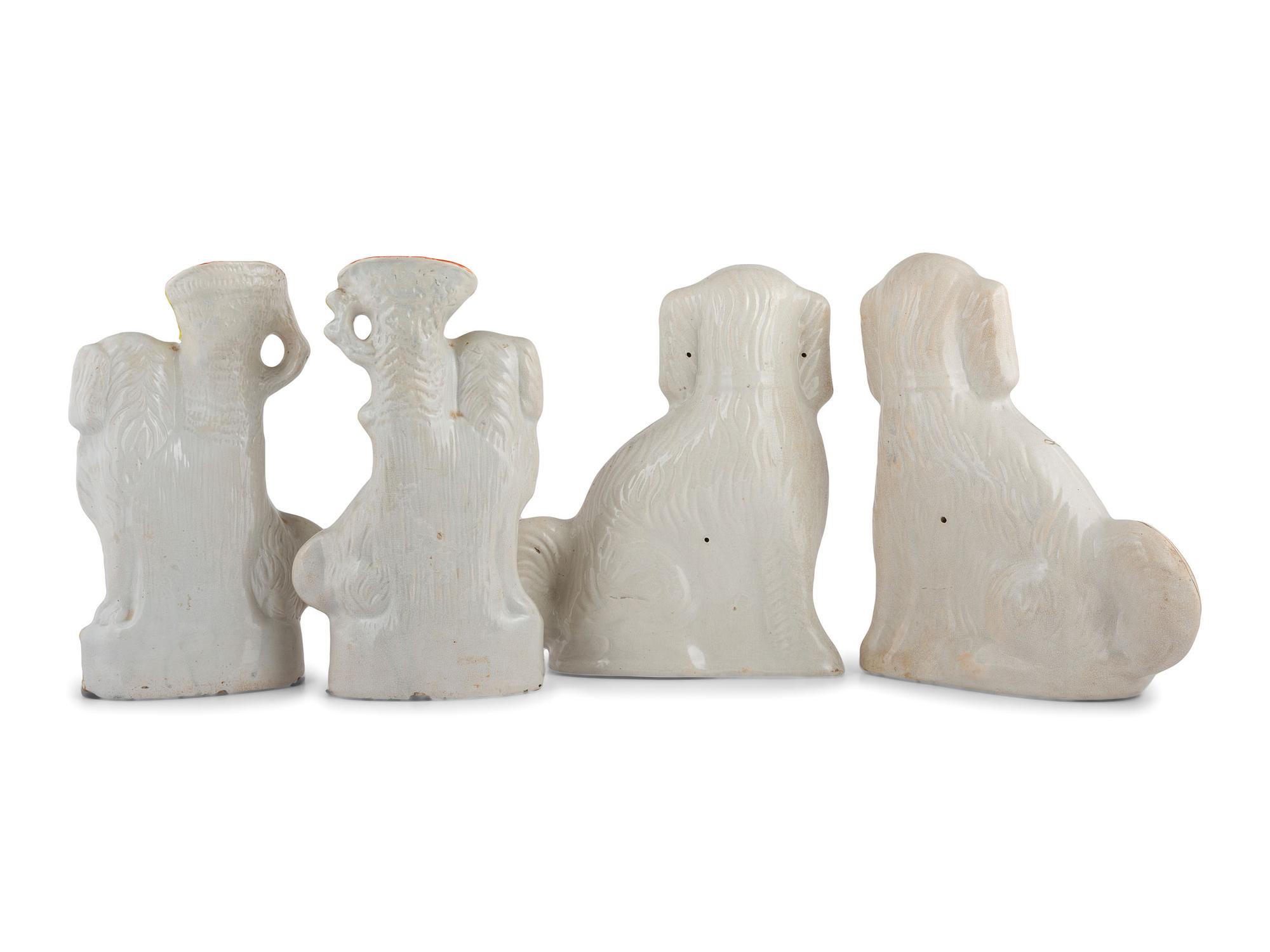 Four Staffordshire Glazed Earthenware Spaniels