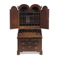 A Queen Anne Carved Oak Double-Dome Top Desk and Bookcase