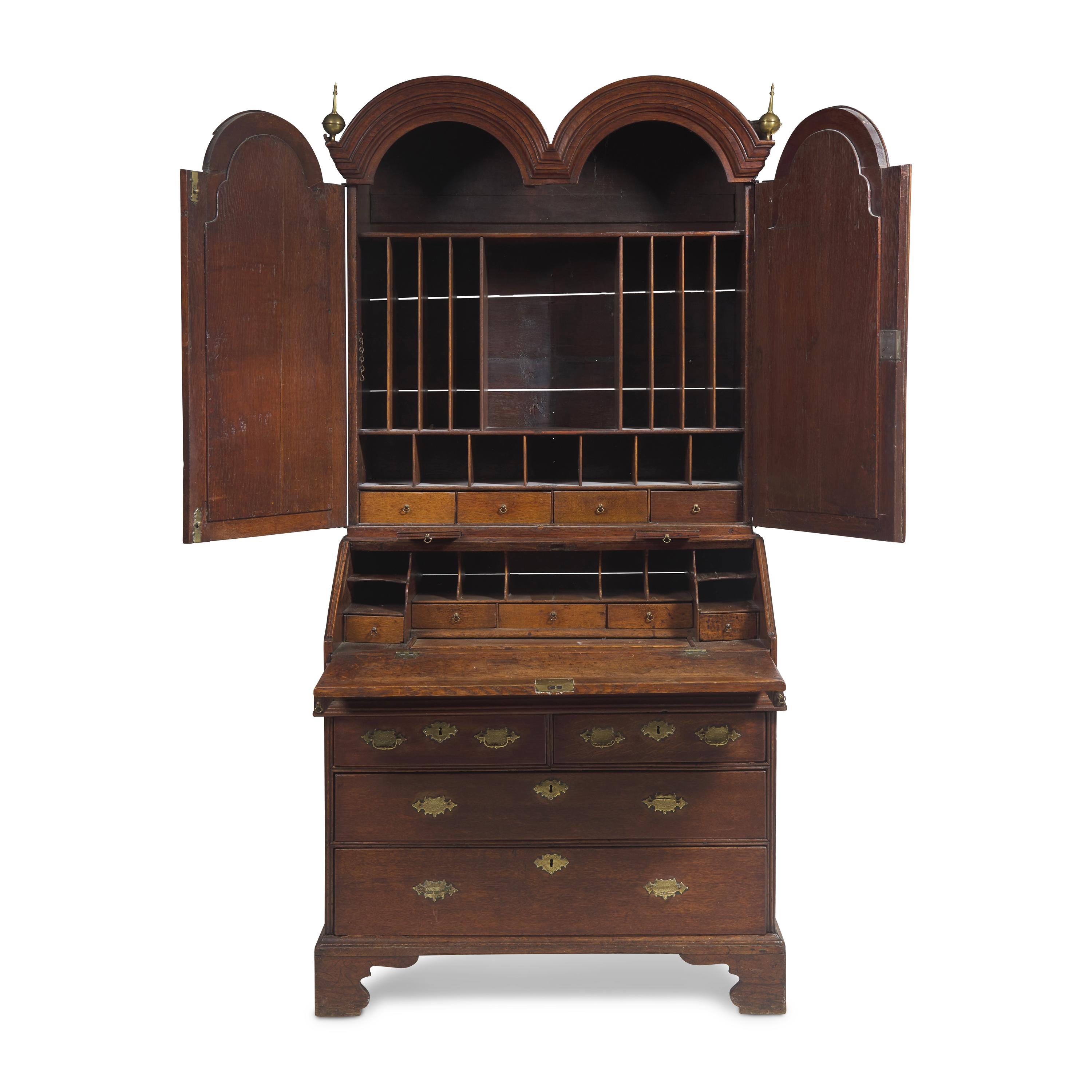 A Queen Anne Carved Oak Double-Dome Top Desk and Bookcase