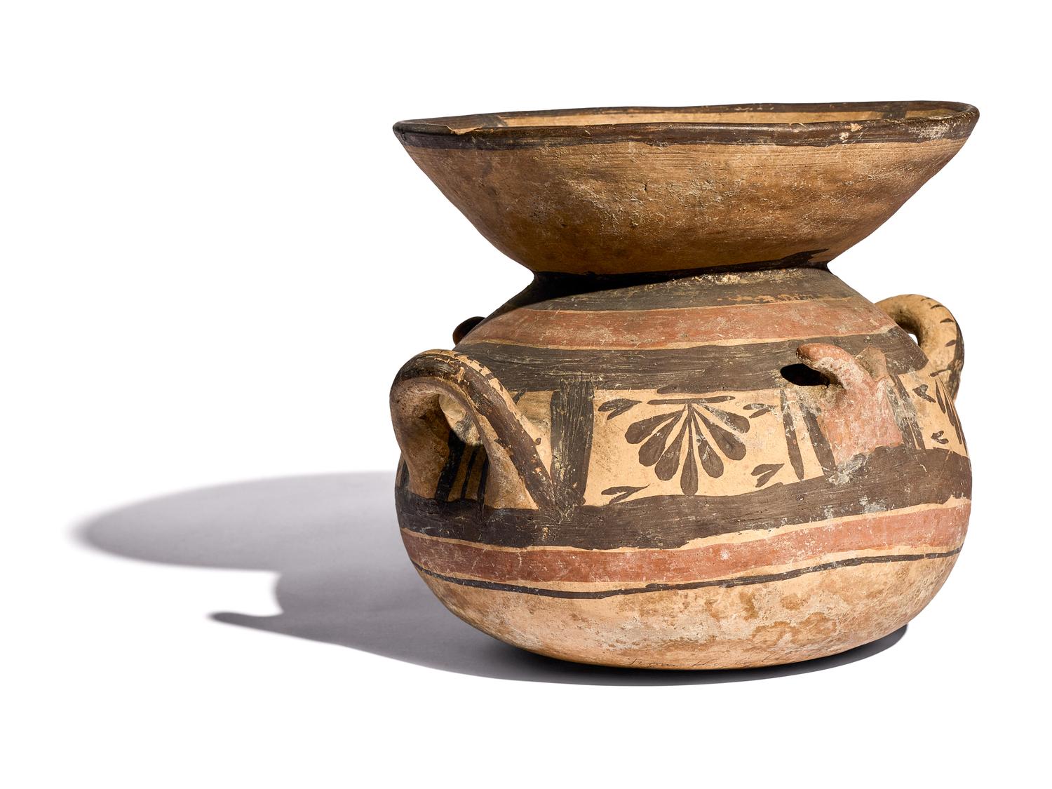A Daunian Painted Terracotta Funnel Krater