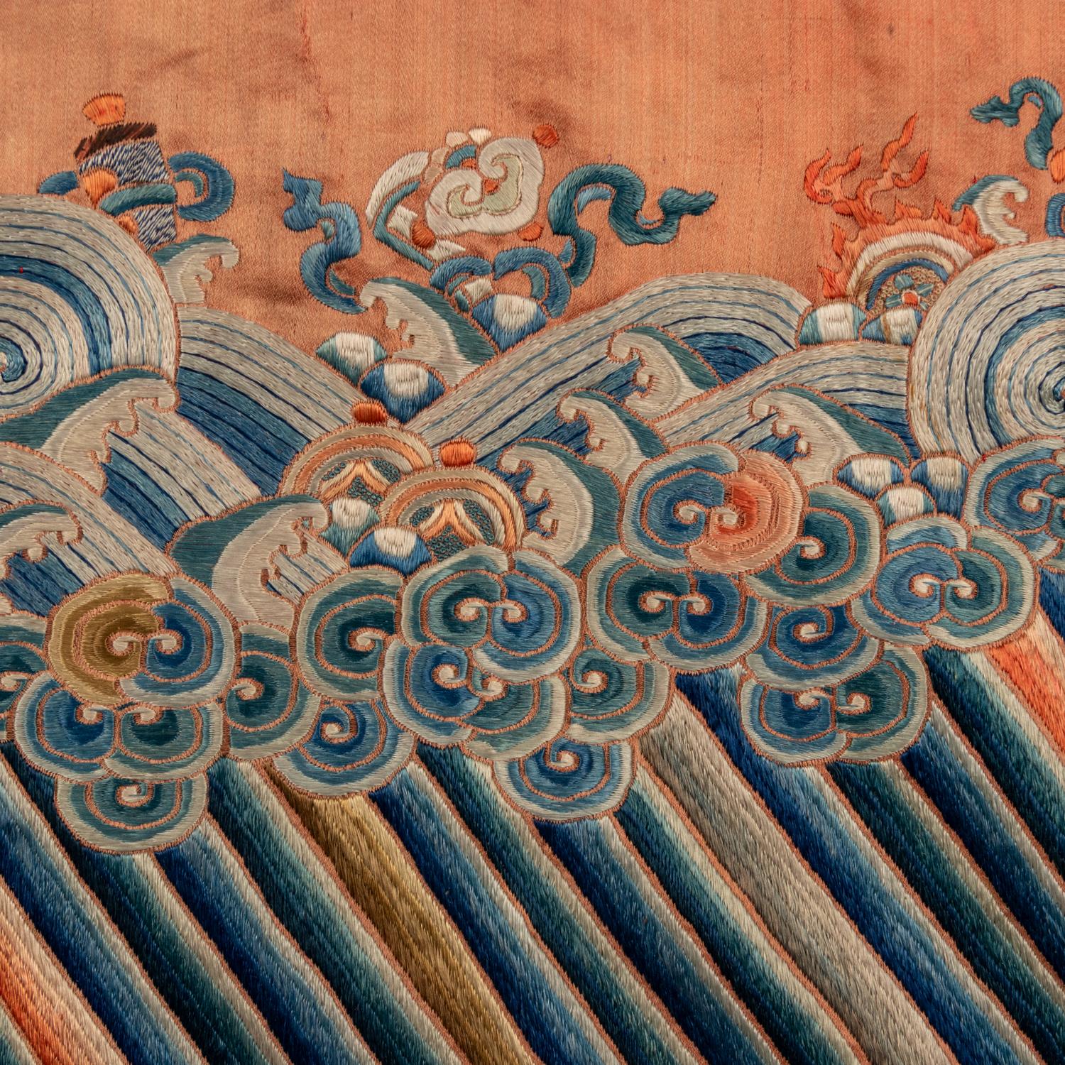 A Chinese Apricot Ground Embroidered 'Peony and Butterfly' Silk Semi-Informal Lady's Robe, Jifupao, late 18th/19th Century 清中期 杏子緞繡八團蝶戀花吉服袍