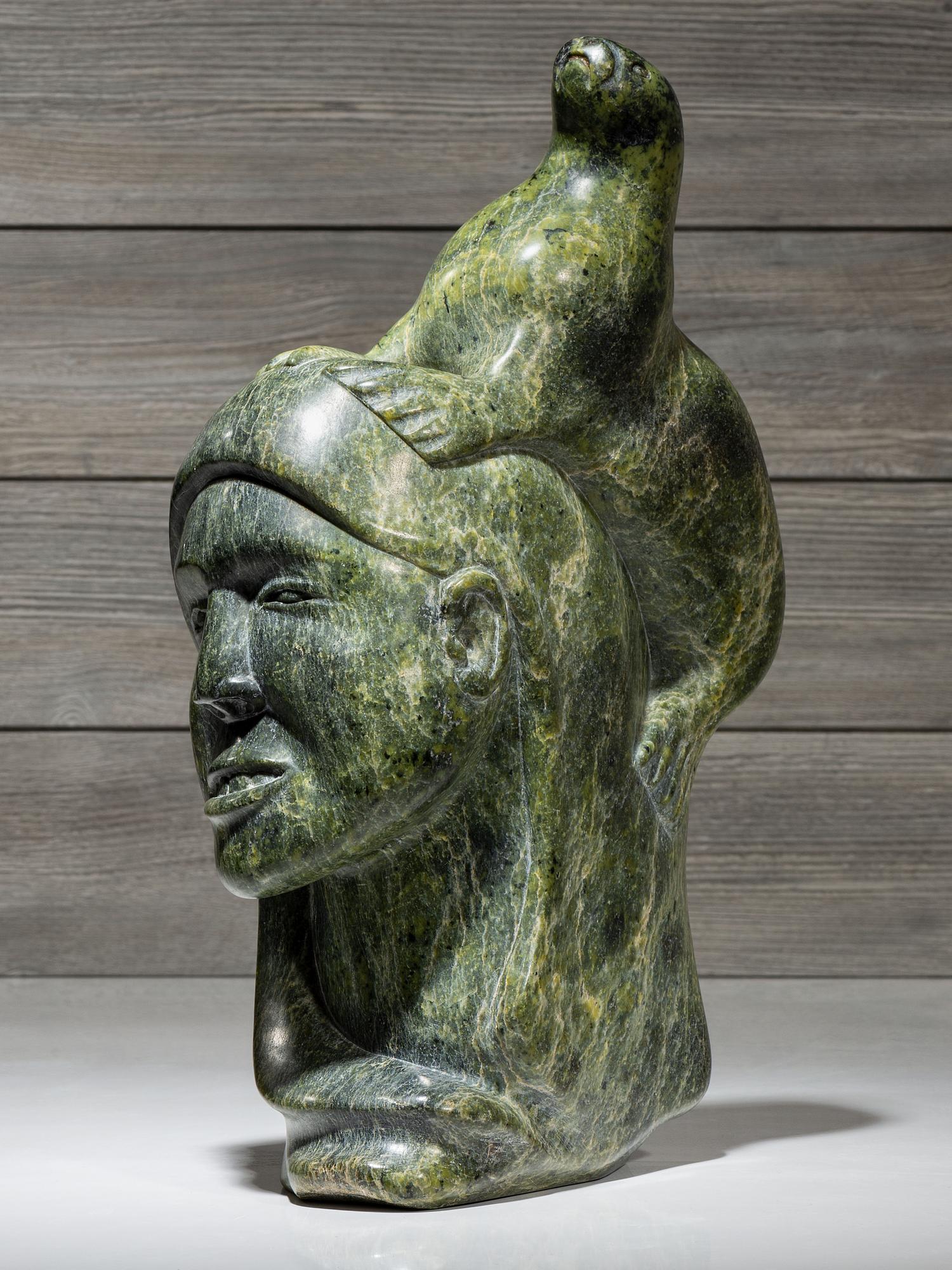 stone sculpture, woman and seal