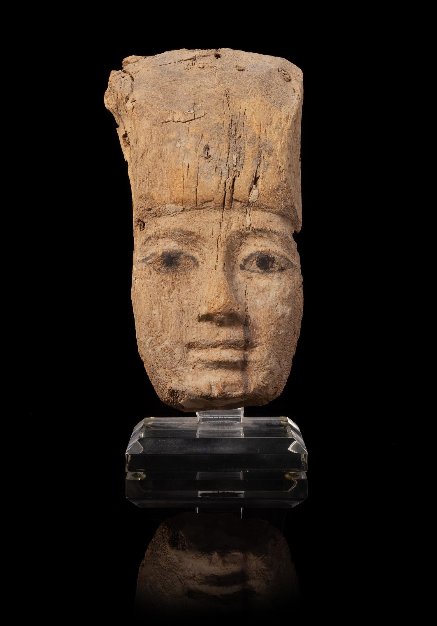 An Egyptian Painted Wood Mummy Mask Height 8 1/4 inches. — LATE PERIOD, DYNASTY 26-30, 664-343 B.C.E.