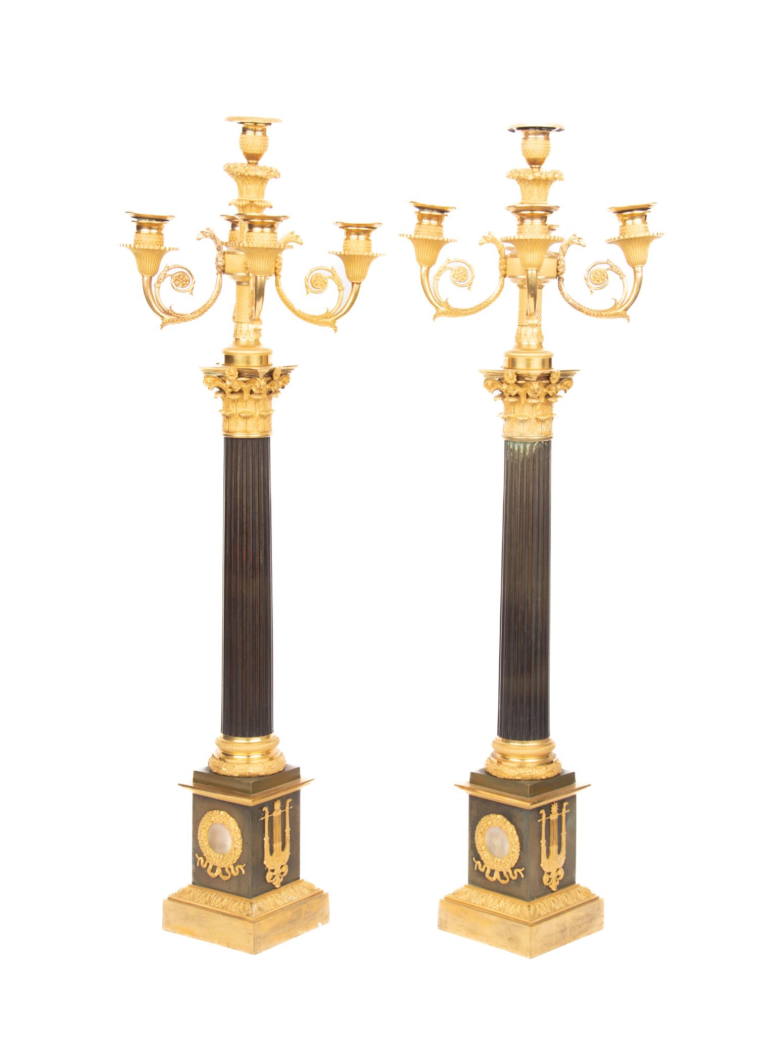 A Pair of Directoire Style Gilt and Patinated Bronze Five-Light Candelabra