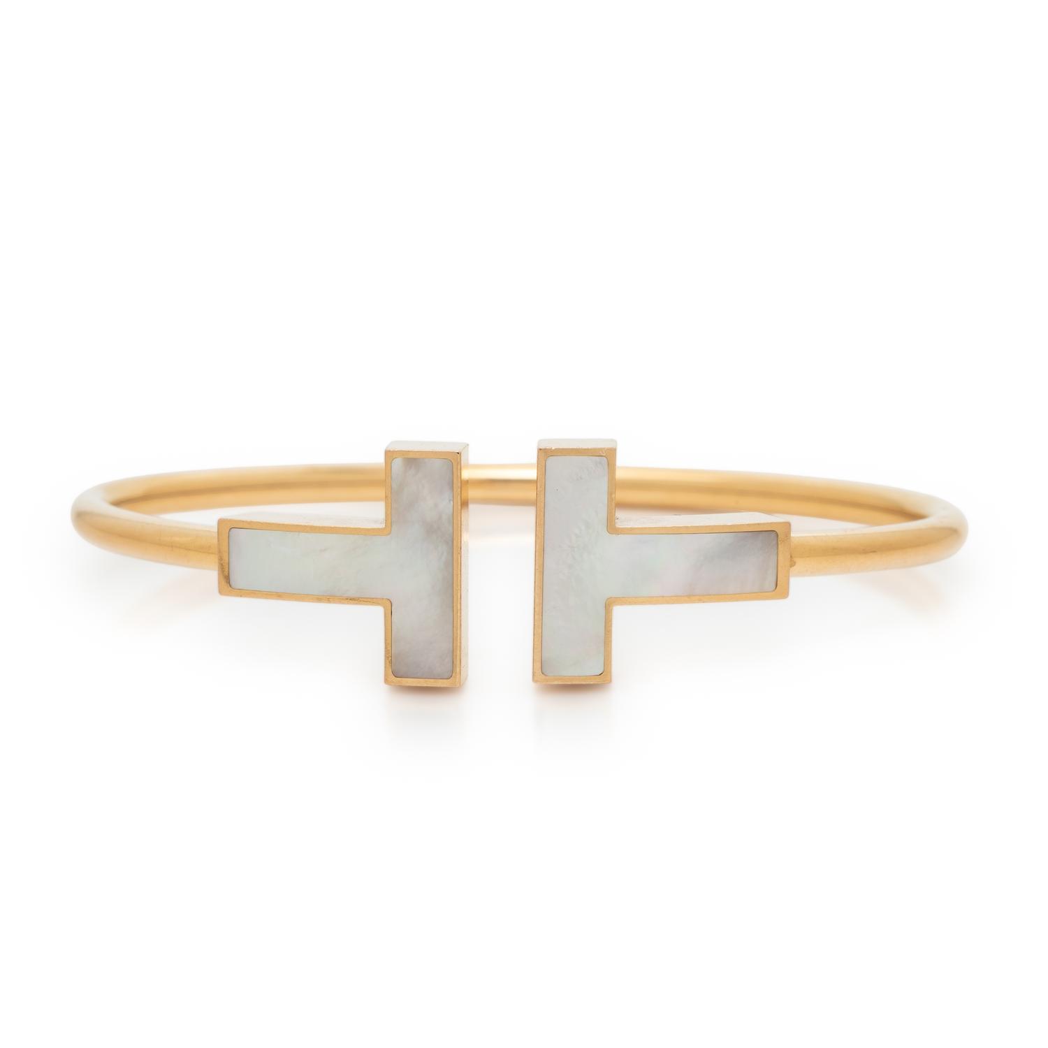 TIFFANY & CO., MOTHER-OF-PEARL AND YELLOW GOLD 'T' WIRE CUFF BRACELET