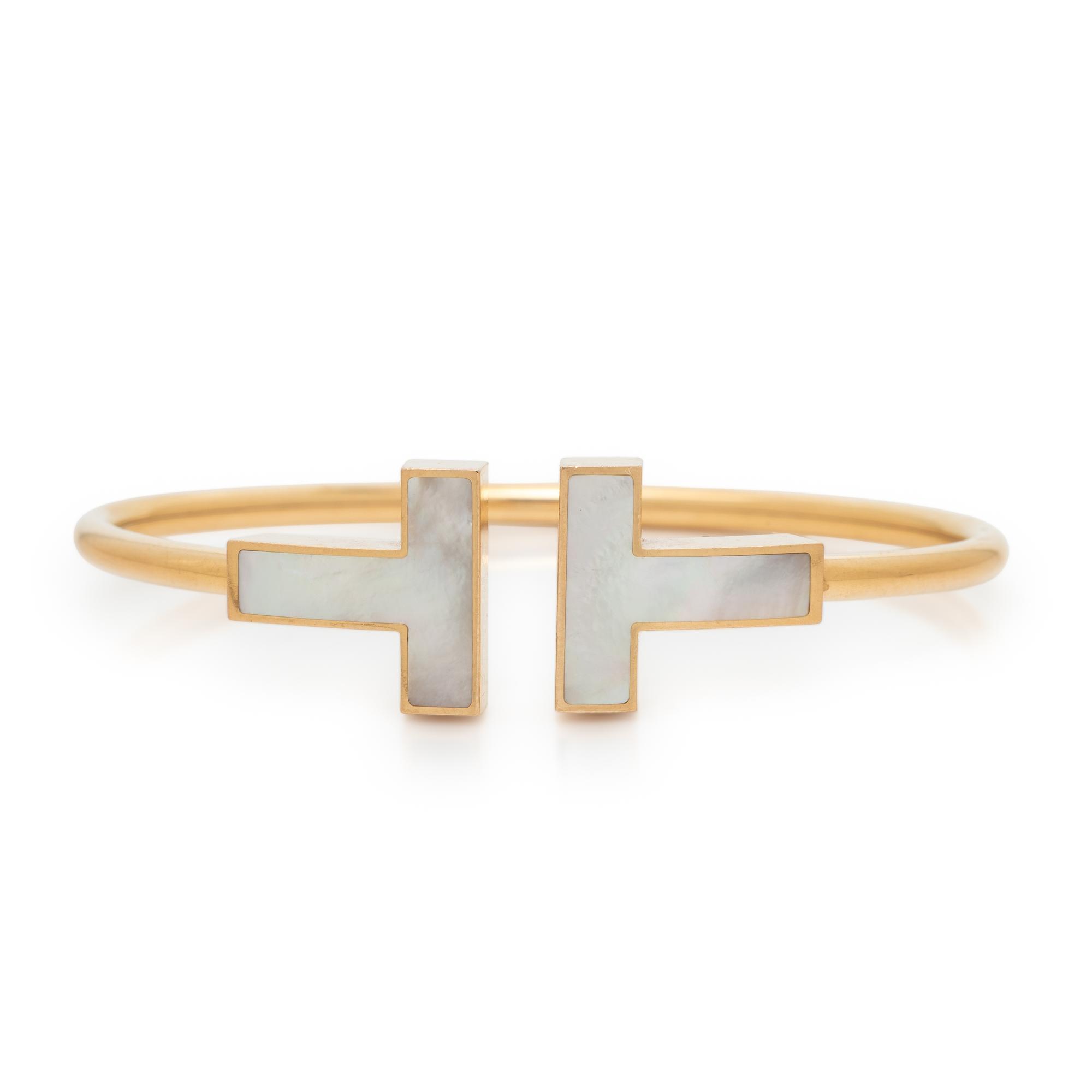 TIFFANY & CO., MOTHER-OF-PEARL AND YELLOW GOLD 'T' WIRE CUFF BRACELET