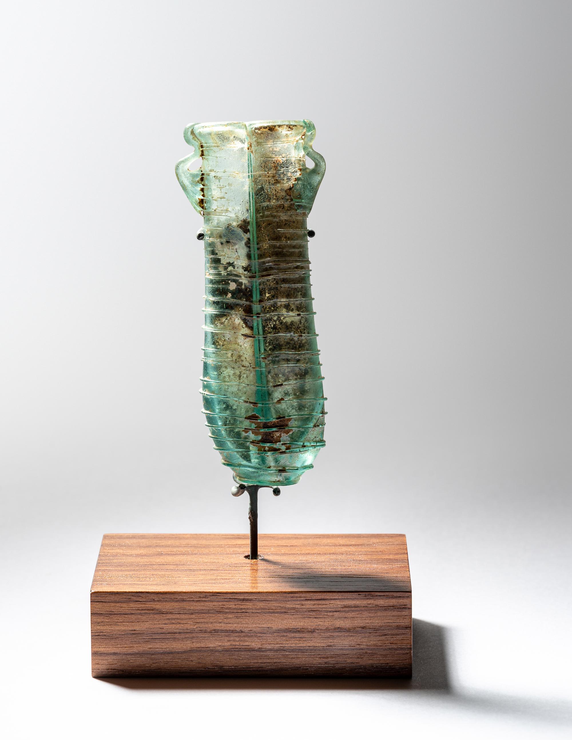 A Roman Pale Blue Glass Double Unguentarium