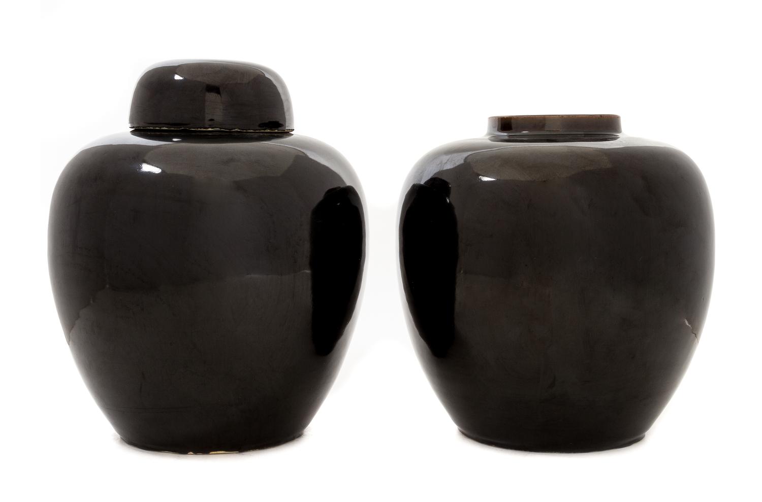 A Pair of Mirror Black Glazed Porcelain Ginger Jars Height 9 1/2 inches.