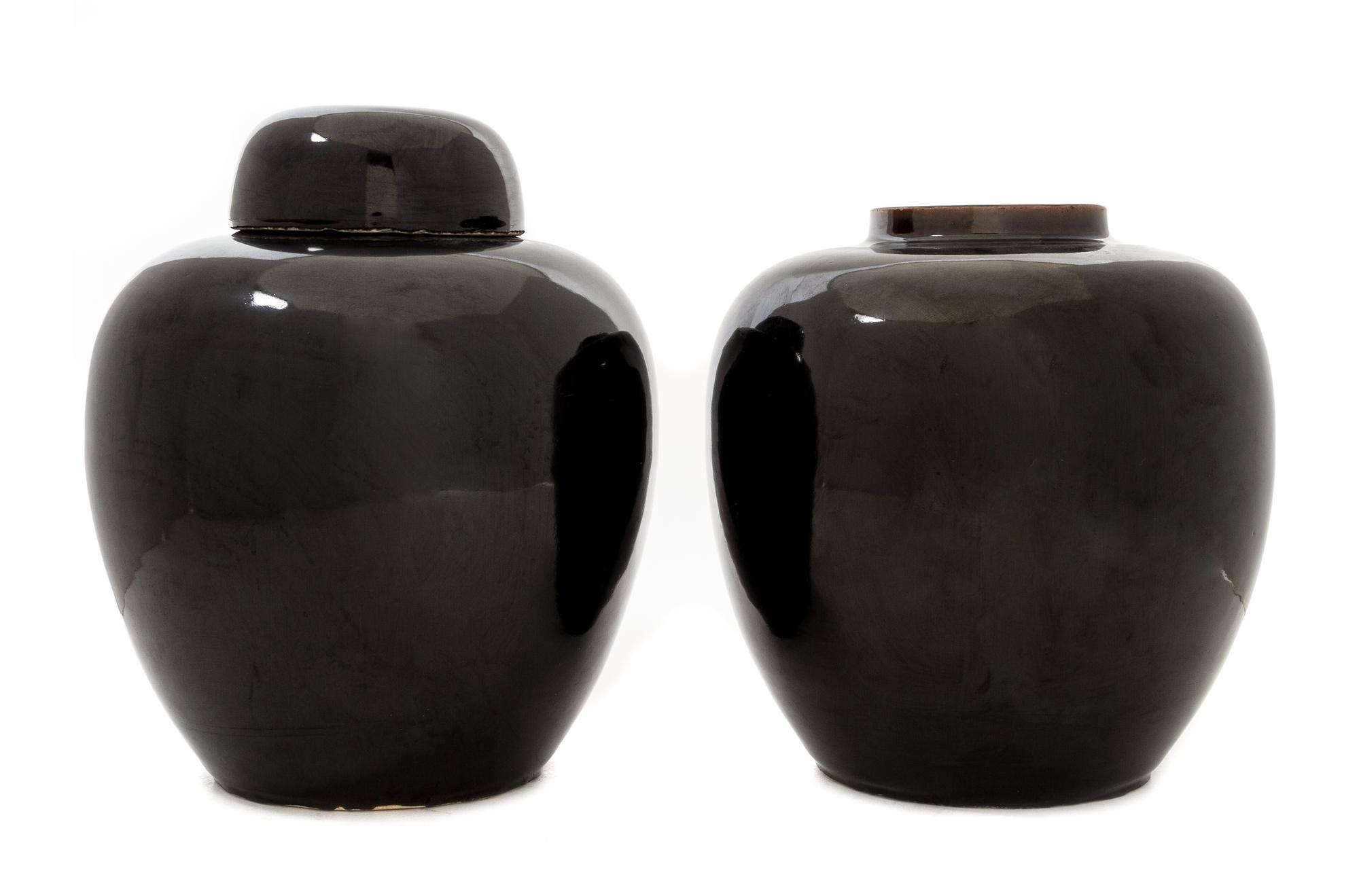 A Pair of Mirror Black Glazed Porcelain Ginger Jars Height 9 1/2 inches.