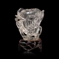 A Chinese Rock Crystal 'Magnolia' Vase with wood stand, 19th Century 清晚期 水晶雕玉蘭花插