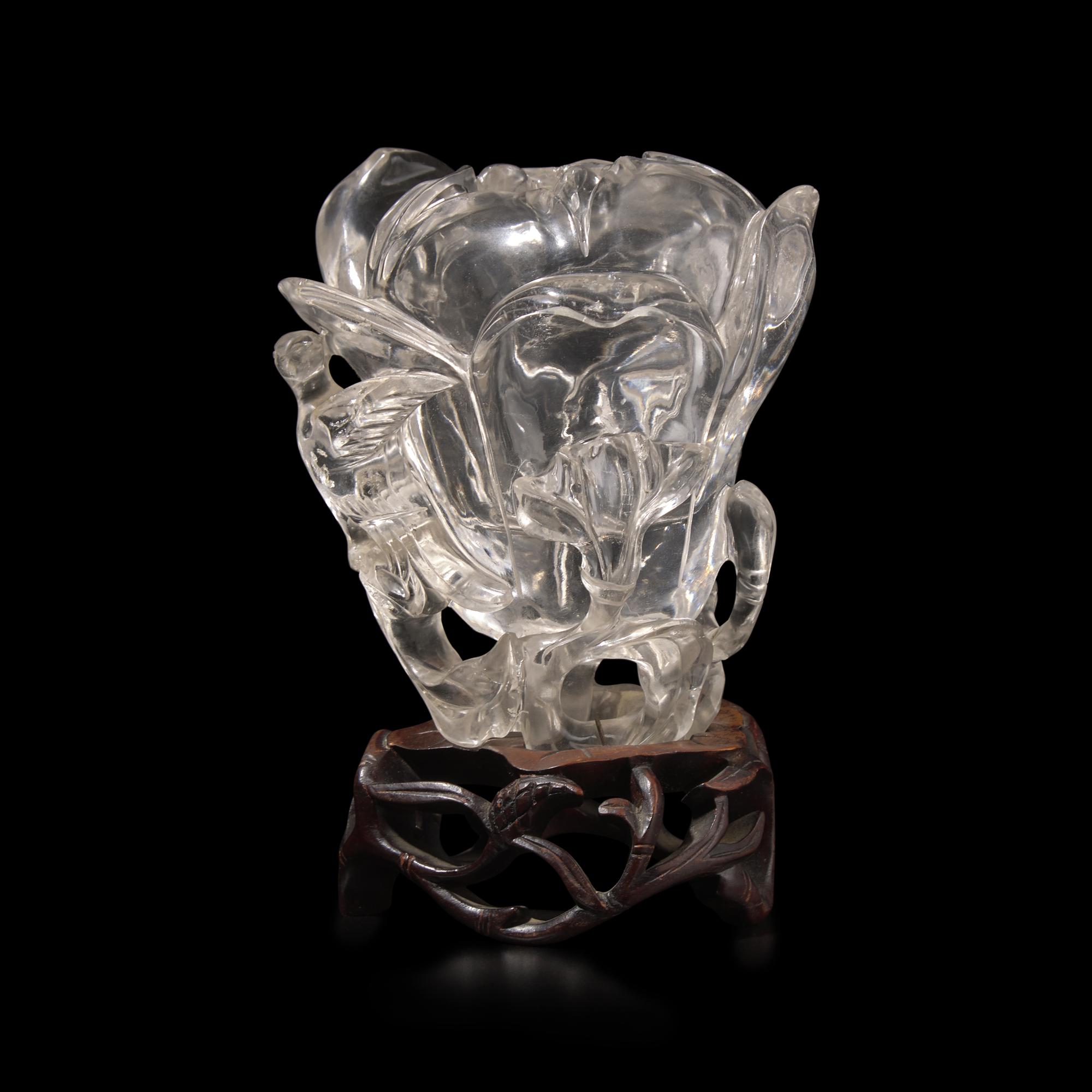 A Chinese Rock Crystal 'Magnolia' Vase with wood stand, 19th Century 清晚期 水晶雕玉蘭花插