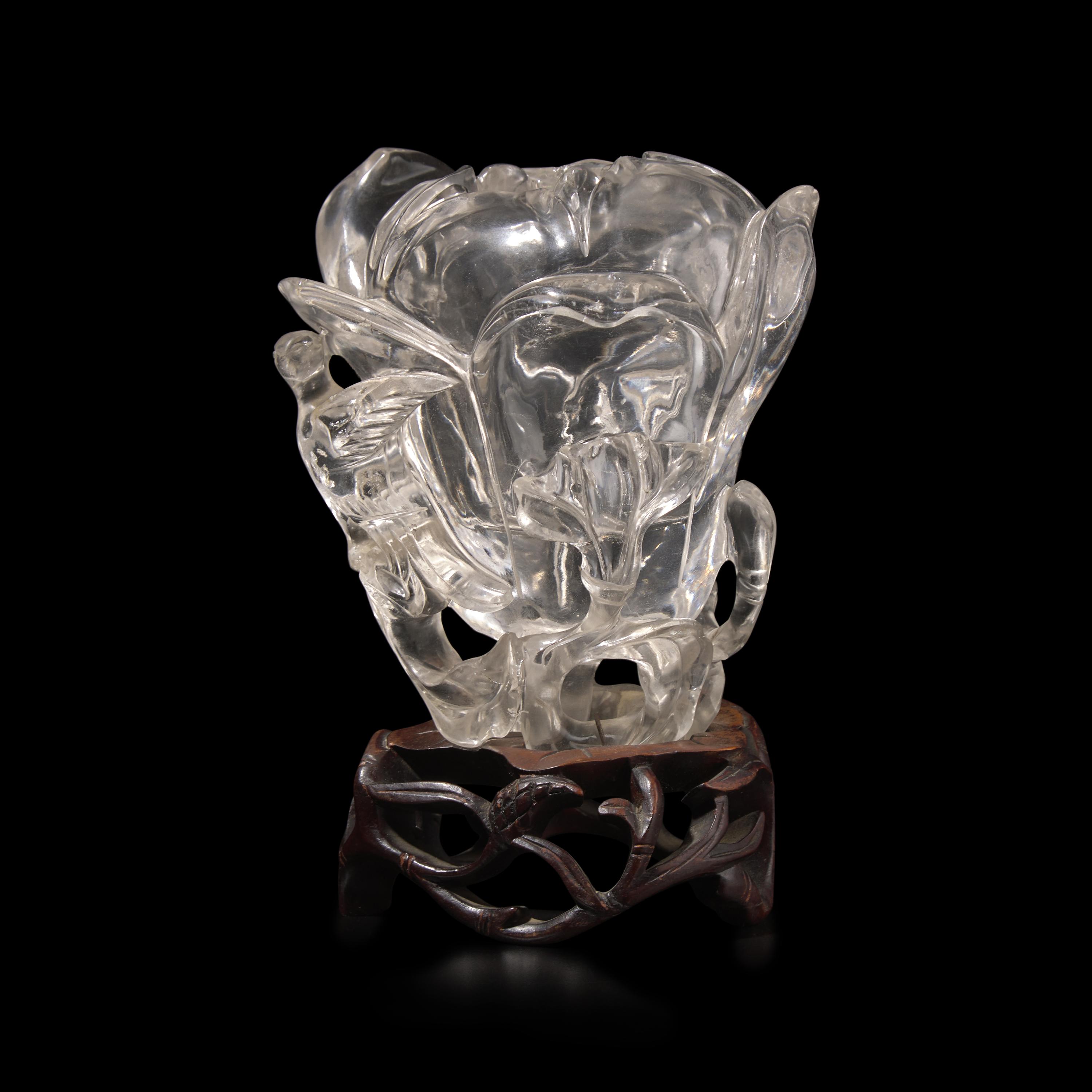 A Chinese Rock Crystal 'Magnolia' Vase with wood stand, 19th Century 清晚期 水晶雕玉蘭花插