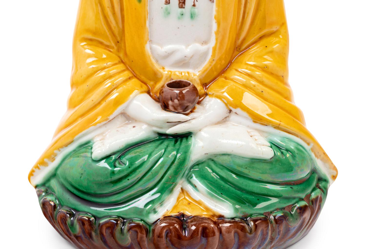 A Chinese Sancai Glazed Biscuit Figure of Buddha Shakyamuni