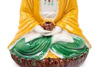 A Chinese Sancai Glazed Biscuit Figure of Buddha Shakyamuni
