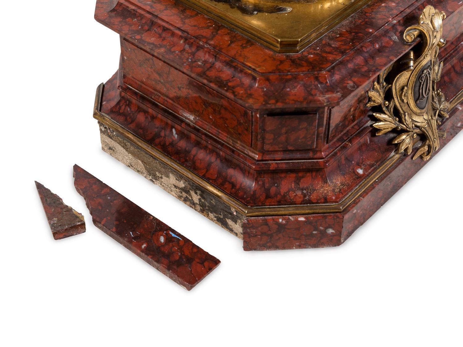 A Napoleon III Gilt and Silvered Bronze and Rouge Griotte Marble Figural Clock