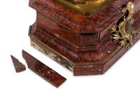 A Napoleon III Gilt and Silvered Bronze and Rouge Griotte Marble Figural Clock
