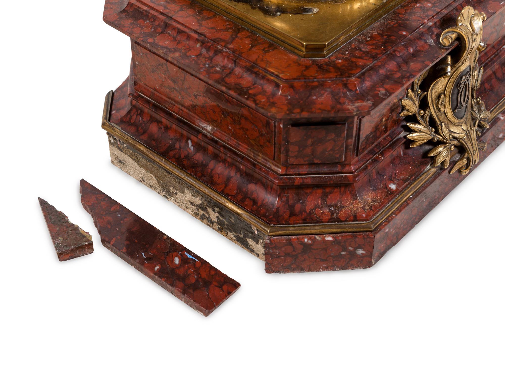 A Napoleon III Gilt and Silvered Bronze and Rouge Griotte Marble Figural Clock
