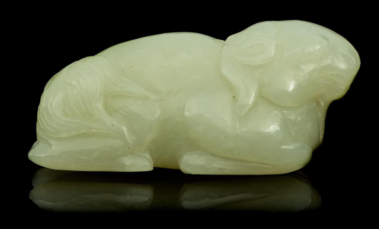 A Carved Jade Toggle Length 2 1/2 inches.