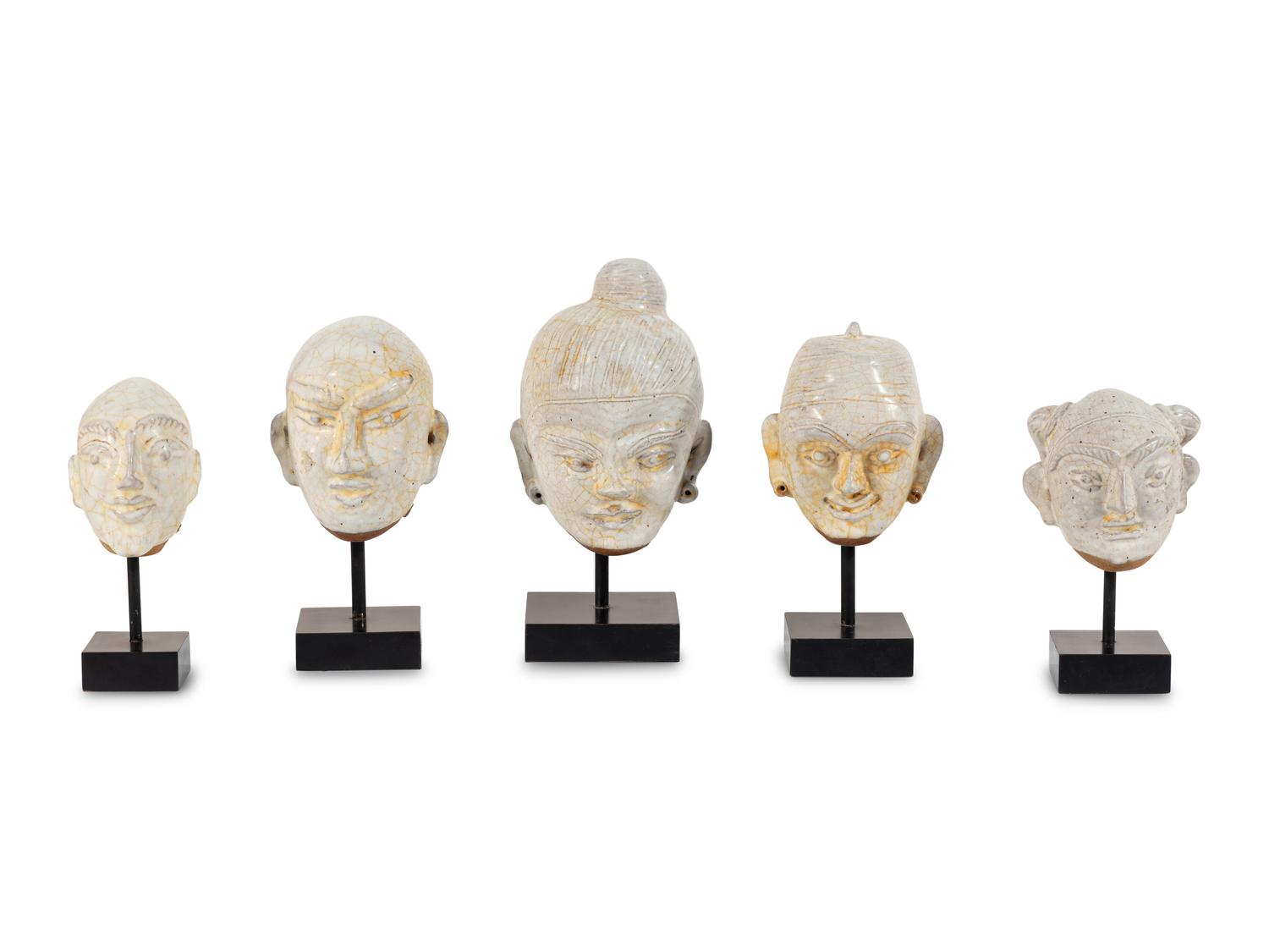Five Glazed Earthenware Deity Heads