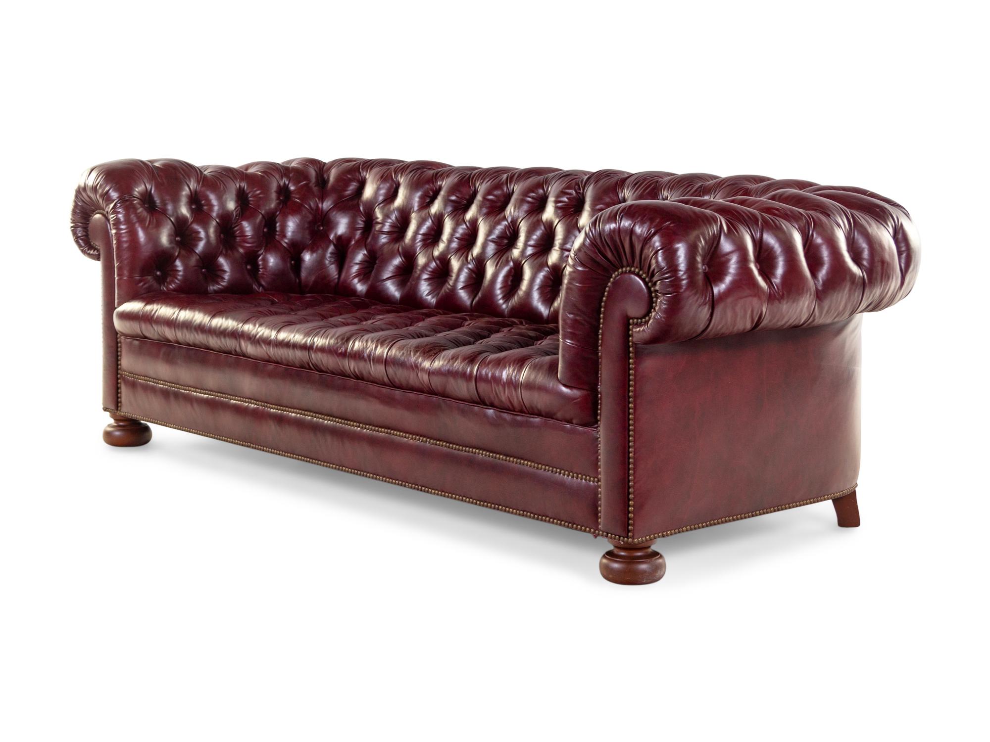 A Tufted Faux Leather Upholstered Chesterfield Sofa